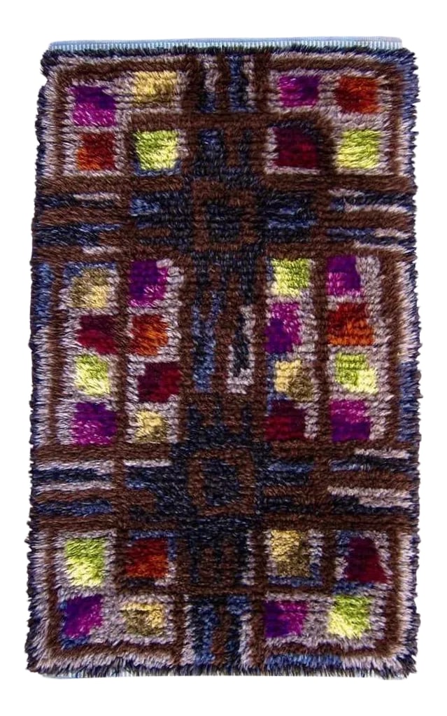 Midcentury Scandinavian Rya Rug or Wall Hanging in Geometric Multi-Color Pattern: A midcentury Scandinavian rya rug crafted of hand knotted high pile wool in a geometric and linear pattern of earthy browns mixed with grays and vibrant pops of color, dating circa 1960s. This vintage