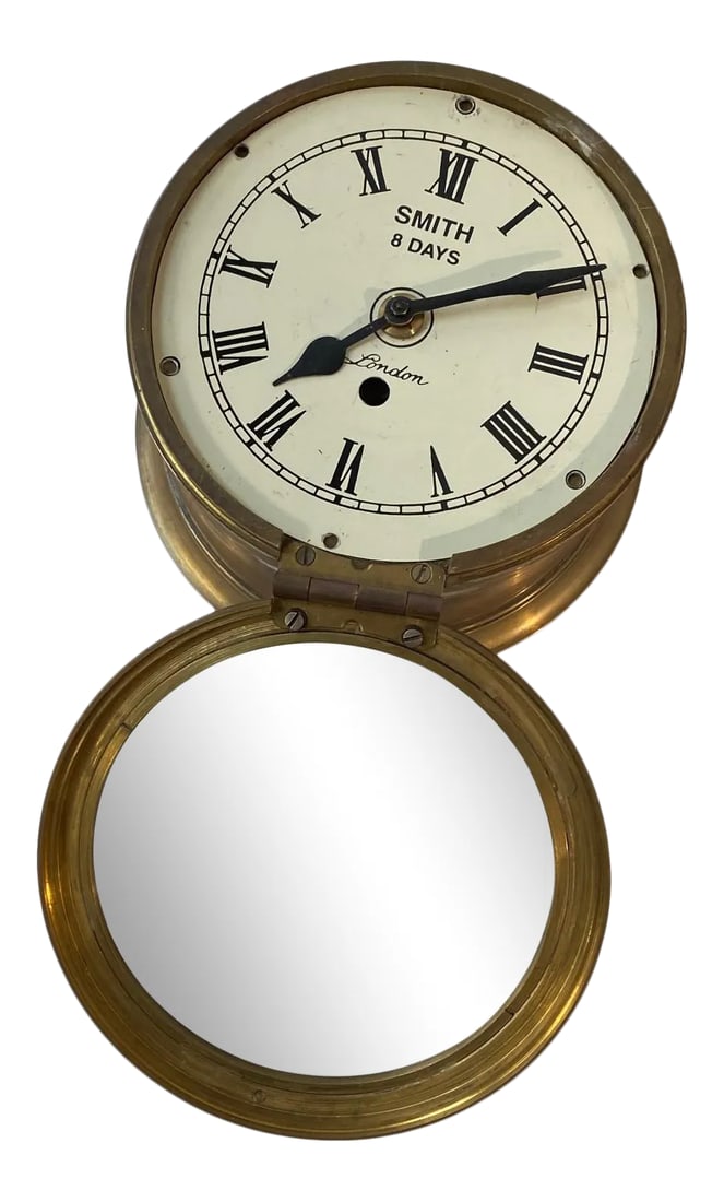 1990s Brass Decorative Ship Clock: Sarreid Decorative Ship Clock Vintage Brass Nautical Design Condition: Alterations: Original Condition Unaltered Imperfections: Some Imperfections Condition Notes: There are some markings on the face 