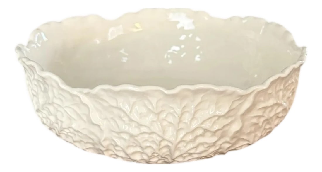 Vintage Creamware / Ivory Cabbage Bowl: A charming, vintage creamware bowl. Features a round bowl with molded cabbage leaves encircling the frame. Beautifully cast and glazed in a soft shade of cream/ivory. Stamped "Erphila Art Pottery" to