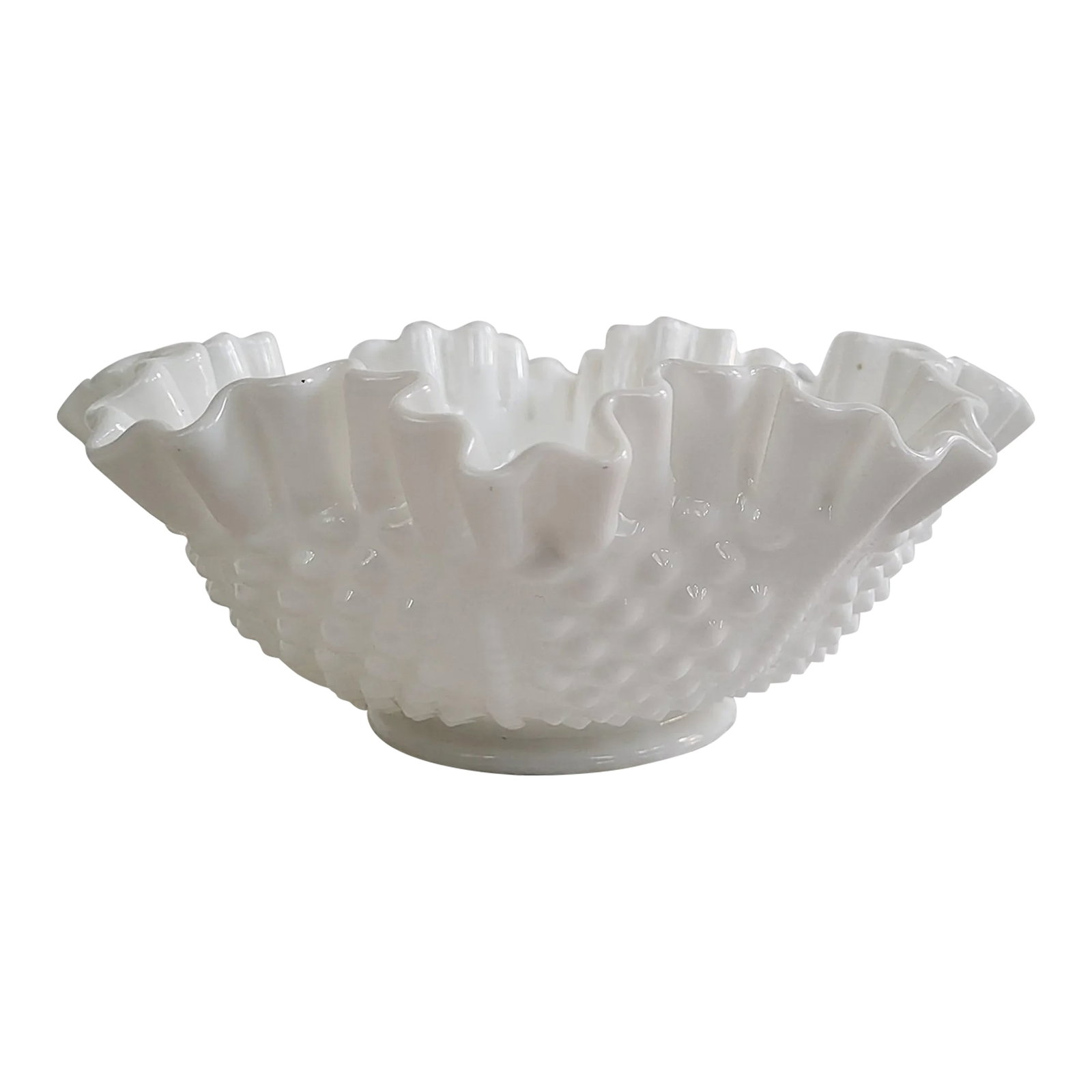 1960s Fenton Hobnail Milk Glass Ruffled Bowl: A medium size Fenton hobnail milk glass ruffled bowl, measuring 8" x 3 1/4" base 3 1/2" h. It has the most charming rope detail. Discovered in Columbia, Maryland and in excellent condition.