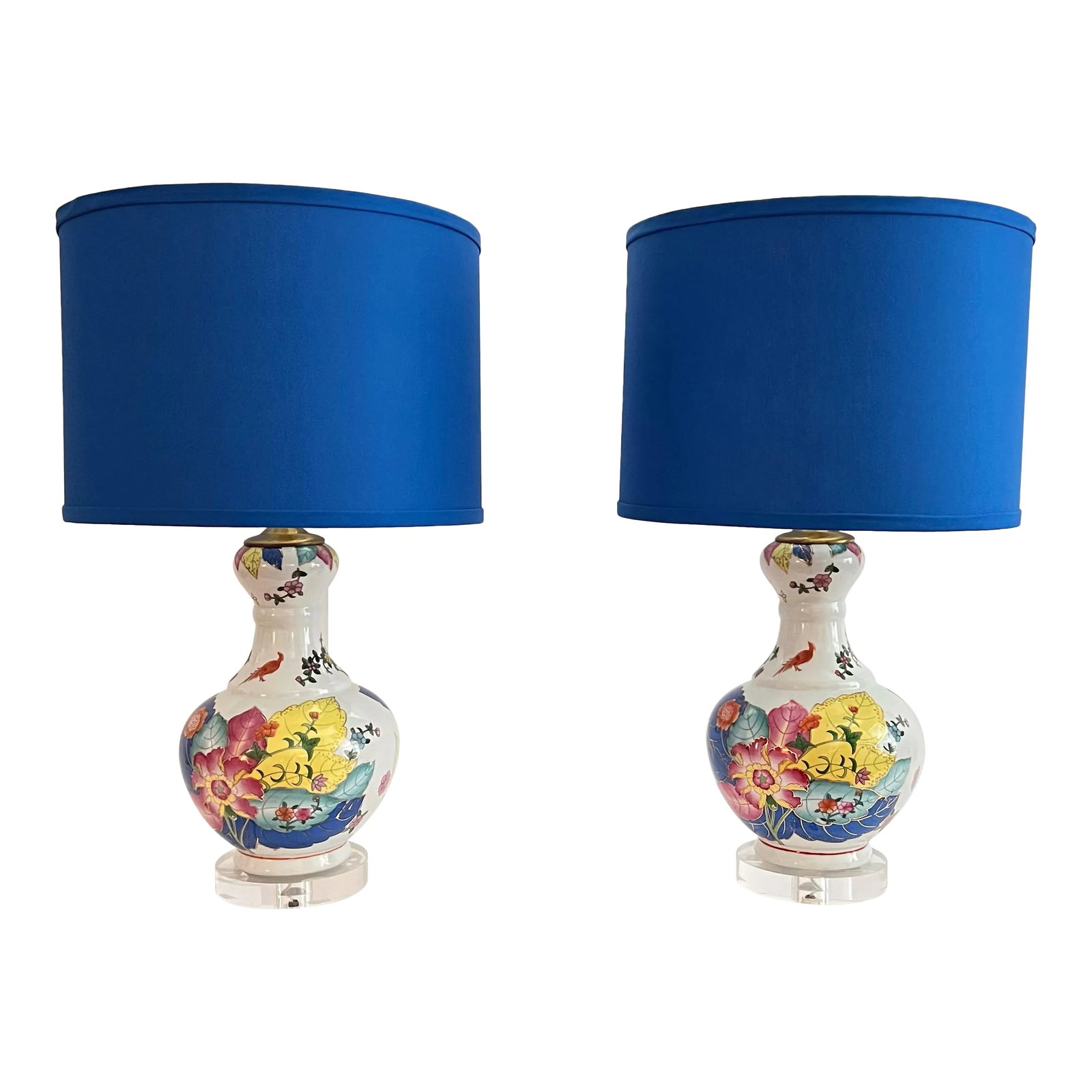 Late 20th Century Chinoiserie Tobacco Leaf Porcelain Lamps With Hued Blue Shades - a Pair: These Chinoiserie porcelain lamps are in the colorful Tobacco Leaf pattern resting on a lucite base with richly hued cornflower blue shades. Design consists of a central pink peony surrounded by