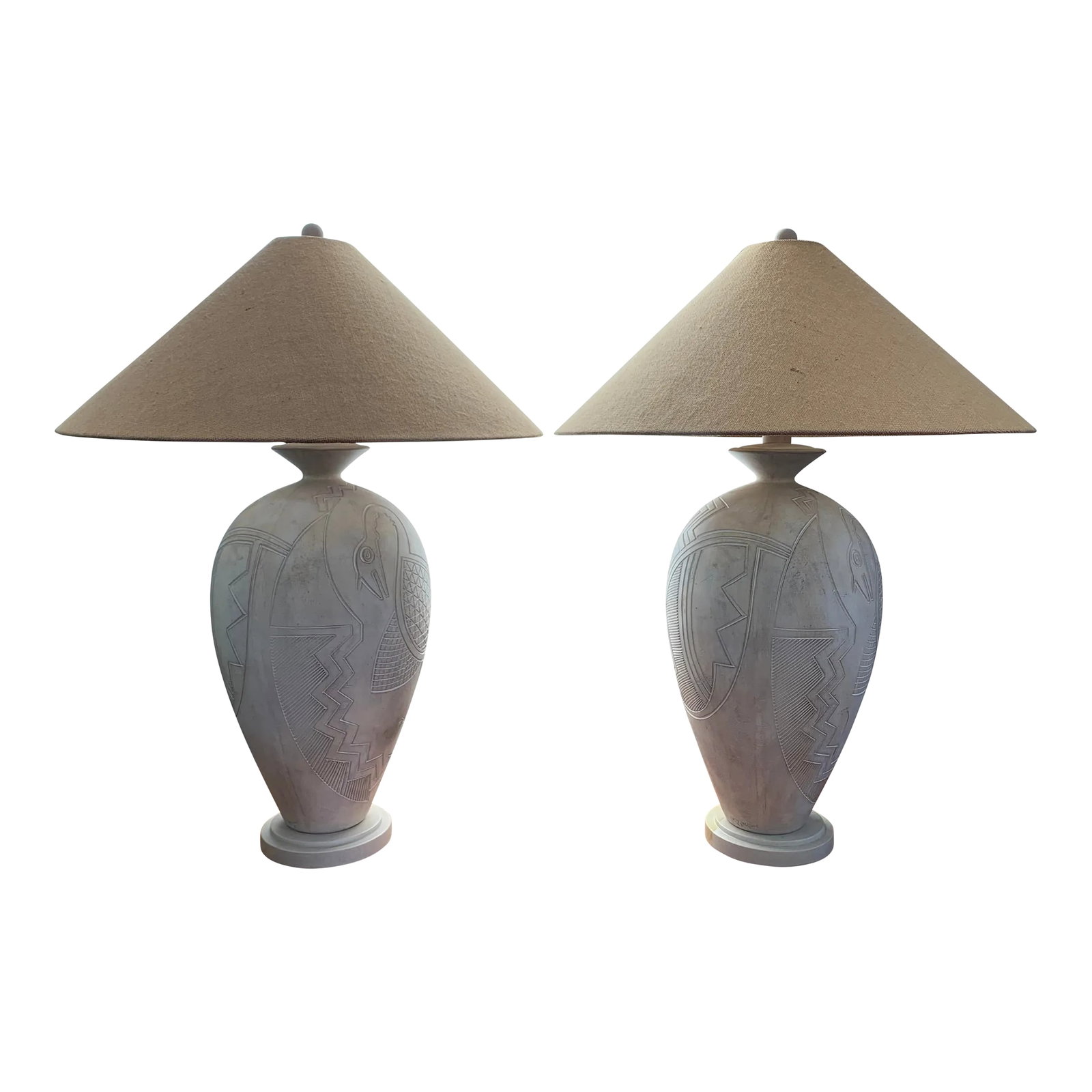 1980s Vintage Casual Lamps of California Tribal Bird Abstract White Plaster Lamps- a Pair: Gorgeous pair of 1989 white plaster lamps with abstract tribal bird in great original condition. Complete with original jute shades and painted wood finials. Impressive 35" overall height to the top o