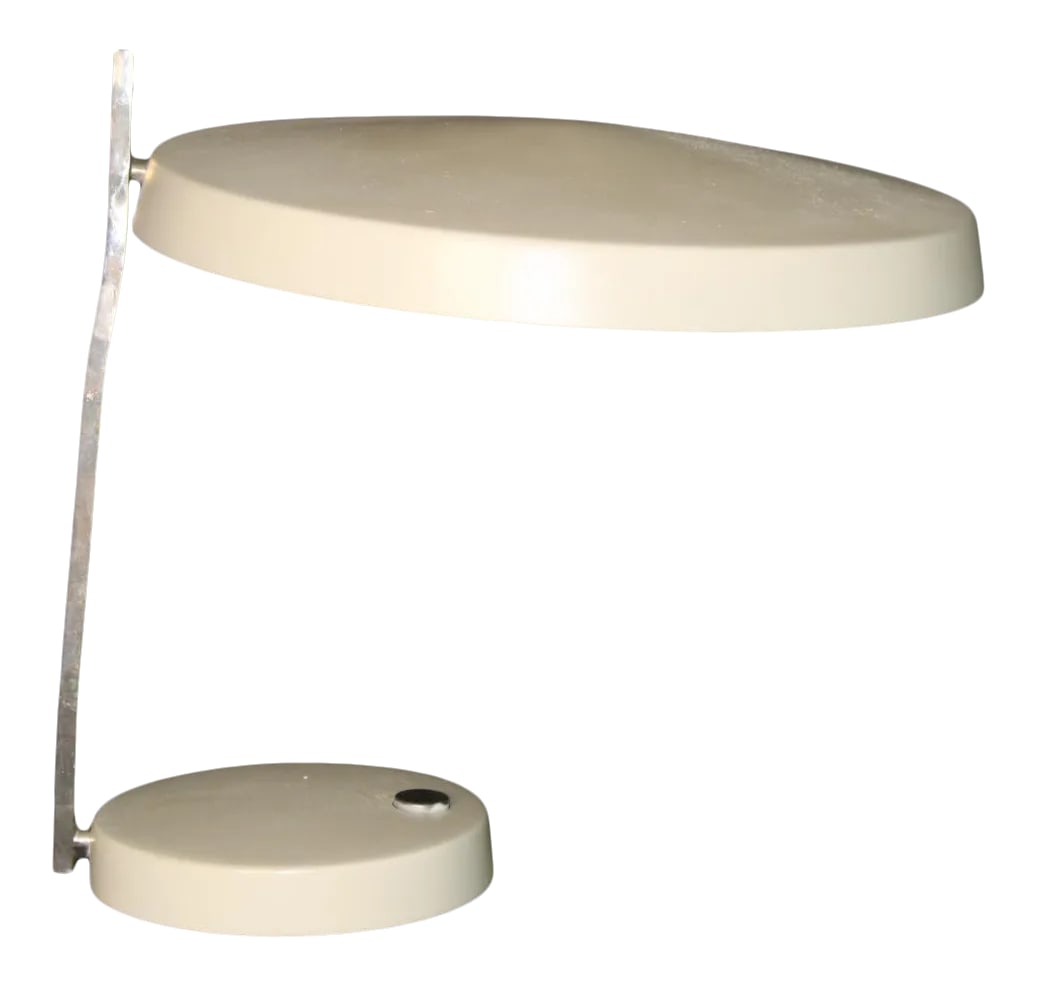 Pavvo Tynell Influence Desk Lamp: Unusual and beautiful. Simple design. Influence of Pavvo Tynell, (circa 1960's) Versatile and functional head pivots side to side for good distribution of light. 11 inches tall,11 inch reach. Base is 
