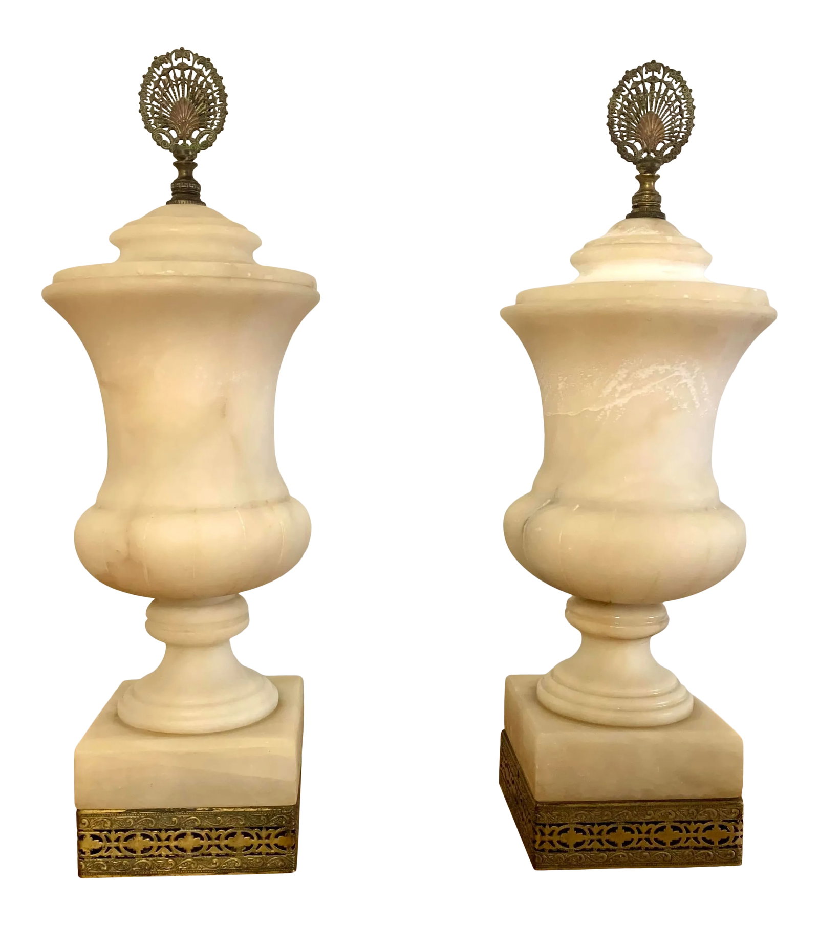 Vintage 1940s Mediterranean Alabaster Urn Lamps - a Pair: Gorgeous pair of Alabaster lidded urn lamps. Masterfully carved with amazing form. Aging gracefully resulting in beautiful caramel coloring and veining. Ornate brass fixtures beautifully accenting