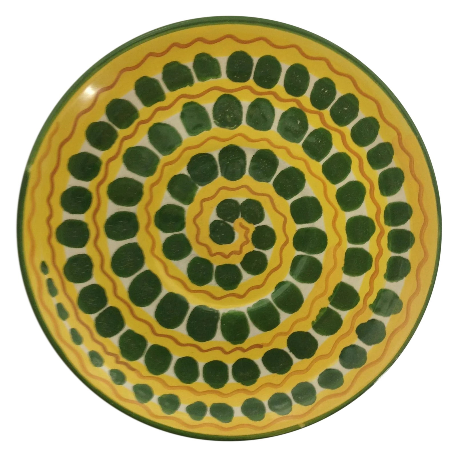Mid-Century Italian Ceramic Plate: This Italian charger features a pattern of green circles spiraling across a yellow ground, with red zig zags adding a touch of zing to the design. A note from the seller: We ALWAYS accept reasonable