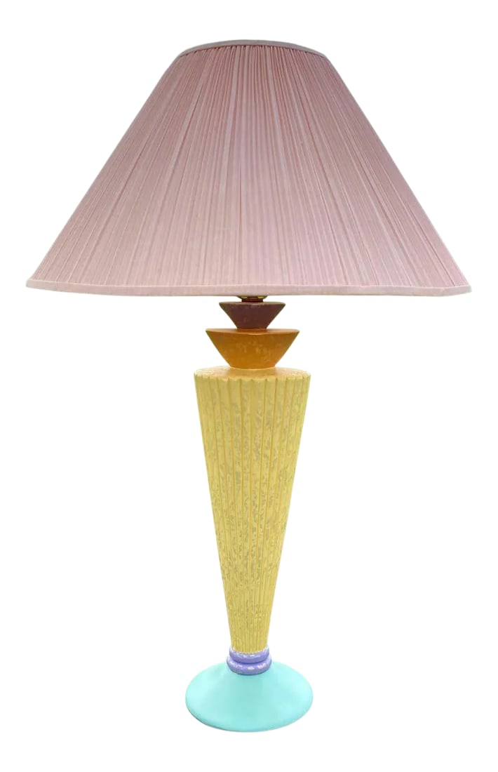 Memphis Style Postmodern Color Blocked Plaster Table Lamp, 1980's: Memphis style color blocked table lamp, circa 1980's. This sculptural modern form lamp features a yellow fluted column with accents of purple, pink, teal, and blue. Lamp shade included. Base: 7" Wide.