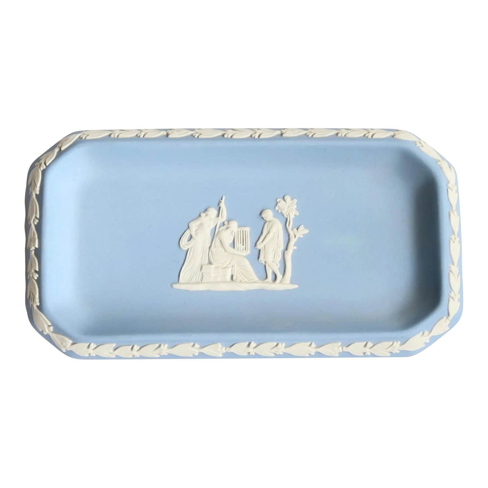 Wedgwood Jasperware Dish: A classic Wedgwood-style jasperware tray in soft blue, featuring a white classical relief vignette framed by a laurel border. Rectangular in form, this piece reflects the neoclassical revival that