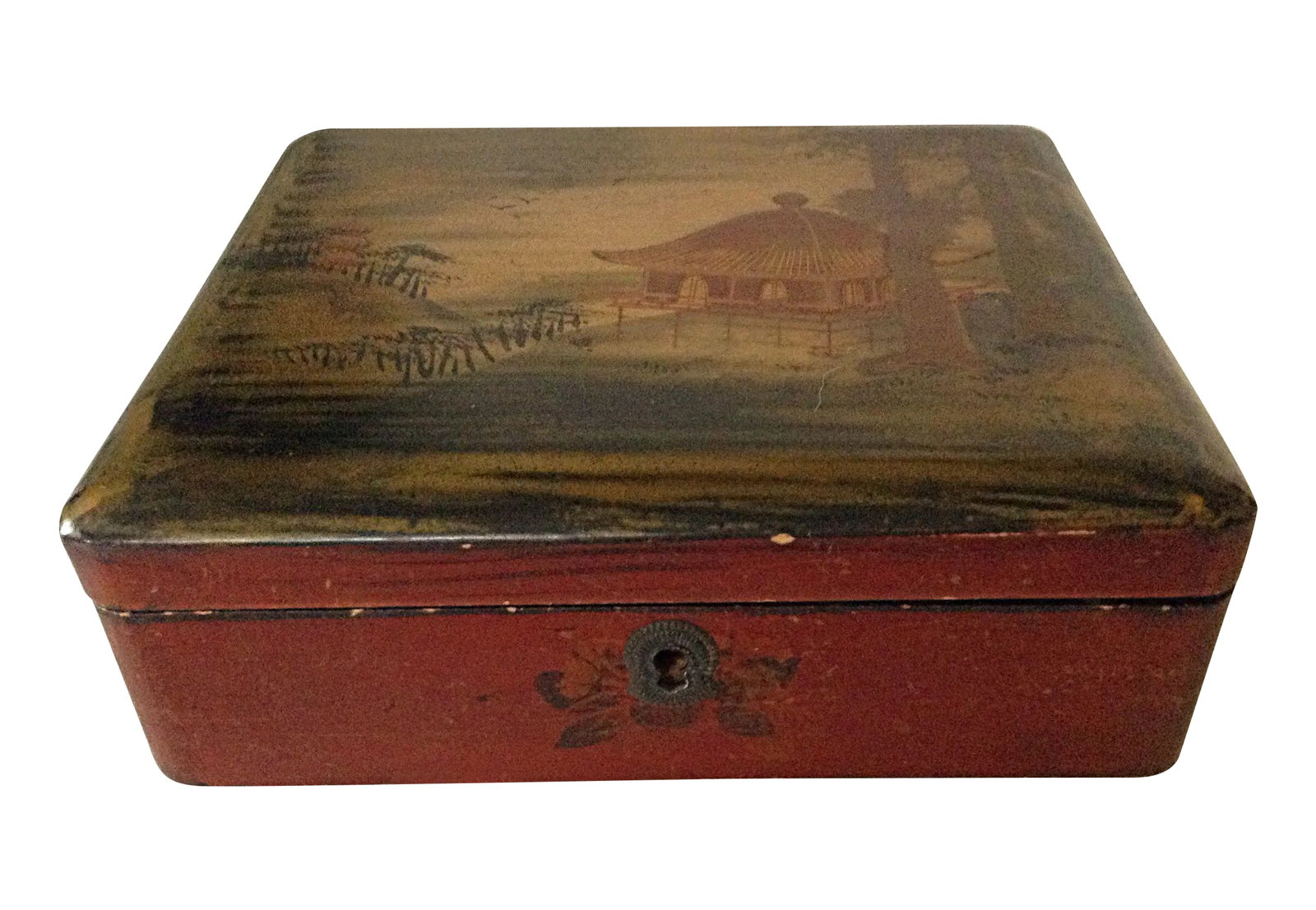 Japanese Lacquered Box: Japanese red lacquered box with black lacquer on the bottom and inside. The top has been hand painted in a lovely village scene in primarily gold as well as a few floral motifs around the sides.