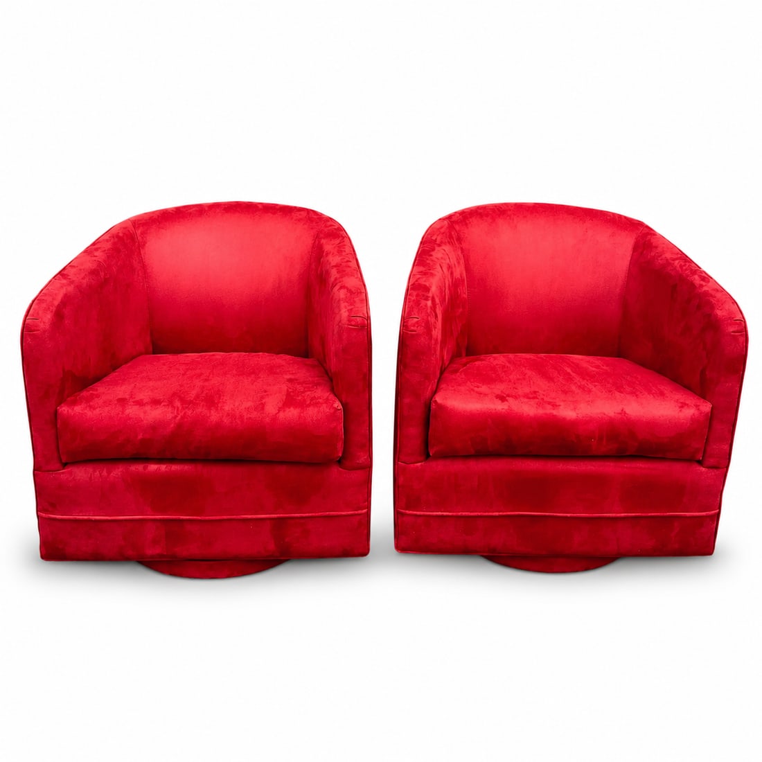 Red Suede Swivel Club Chairs - a Pair: Pair of 1980s vintage swivel club chairs in a red suede fabric. These chairs have a retractable swivel mechanism, returning to their original position. Cushions are very comfortable, so they are funct