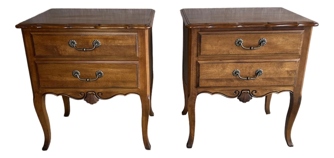 Pair of Ethan Allen French Country Nightstands: Charming pair of Ethan Allen French Country nightstands with two drawers and featuring shell carving, cabriole legs and pewter drawer pulls. Constructed of solid cherrywood with dovetailed drawer