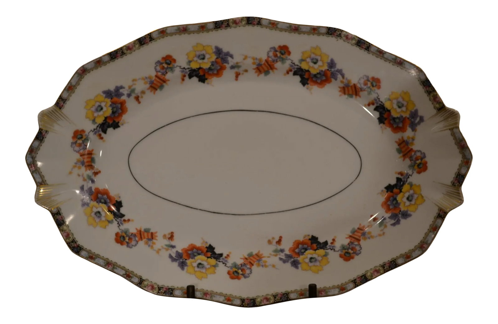 Vintage German Porcelain Serving Platter: Beautiful German oval serving dish Colorful floral design on edges and interior of dish Gold trim on outer edges of dish Marking on bottom of plate indicates 'Bavaria' (see photo) Condition: Alteratio