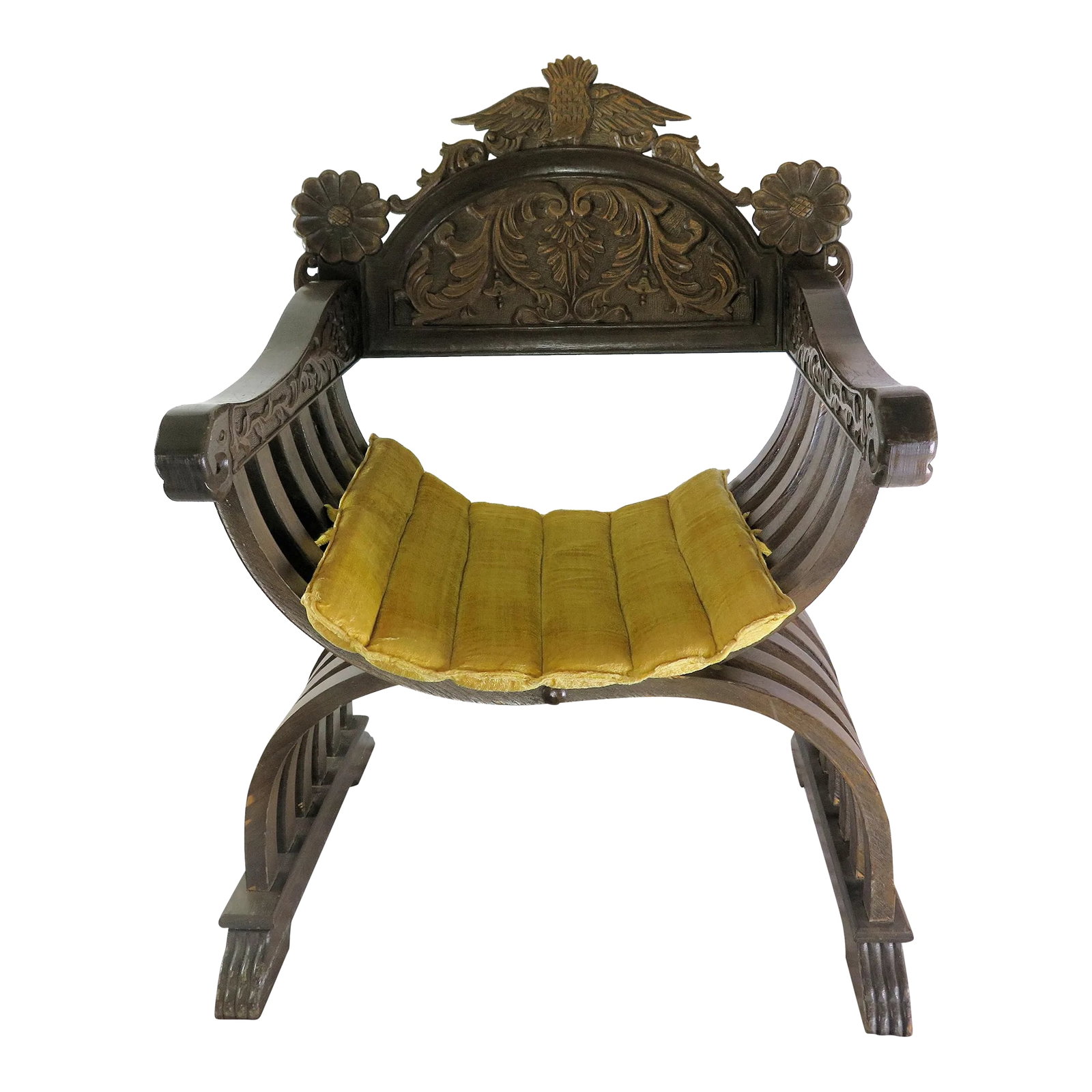 X Savonarola Italian Curule Chair With Original Velvet Seat Cushion: This heavy walnut Roman X chair is a exquisite example of the Savonarola royal chair. The intricately carved back and arms are depicting the fantastical Griffin that had a lions body represented by