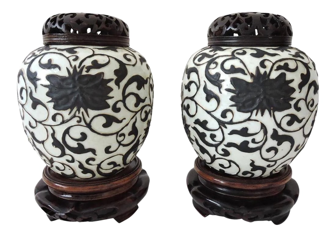 Rare Republic Peony & Iron Brown Crackle Glaze Chinese Ginger Jars With Wood Stands & Reticulated To: A pair of rare and fine matching dark brown and antique white ginger jars complete with custom made hand carved rosewood stands and reticulated rosewood tops. Applied black slip in raised relief formi
