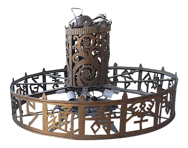 Large Antique American Pierced Brass Chandelier c.1910-1930: Great design & a beautiful piece of American history! This large haute design antique pierced brass chandelier features stylized asian lettering around the circumference of the piece. The cylindrical