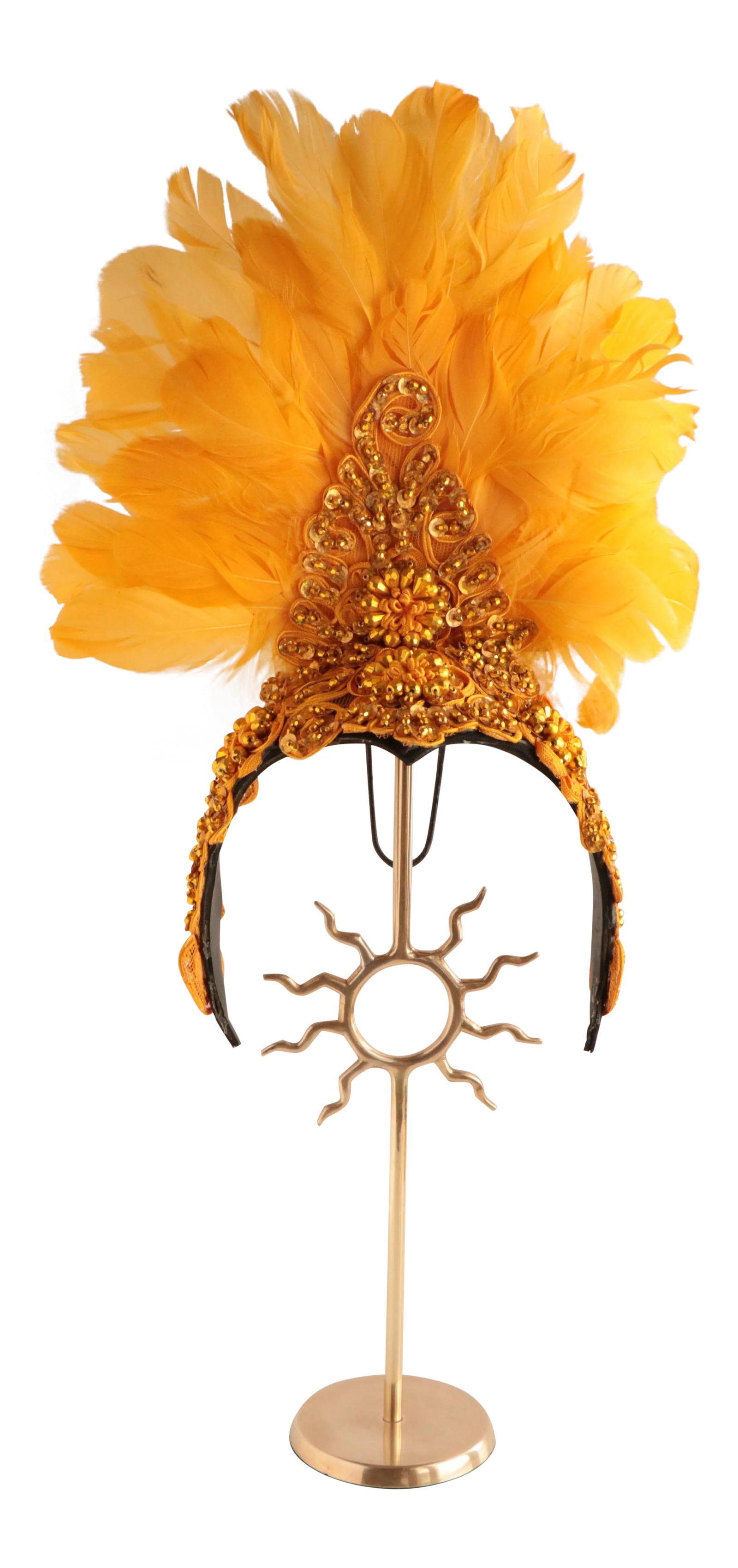 Festival Feather Headdress on a Brass Stand: Glamorous feathered headdress in gold and yellow, perched on a solid brass stand -instant maximalist flair & a dash of the unexpected. Condition: Alterations: Original Design Modified Imperfections: