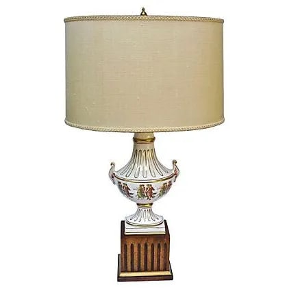 Antique Italian Classical Urn Lamp: Antique (1900-1910) Italian classical urn lamp with hand-painted dancing women in classical attire. Hand-painted acanthus leaf handles and gilt accents. Fluted wood base. Materials: ceramic/wood/silk/