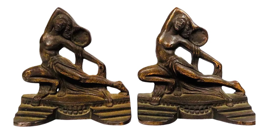 1920s Art Deco Bronze Dancing Nude Women Bookends: Very rare pair of 1926 Antique Art Deco Dancing Nude Women with Tambourines. A distinctively Art Deco Design... minimally ornate and cast in Bronze. The tambourines and the unique positioning of the