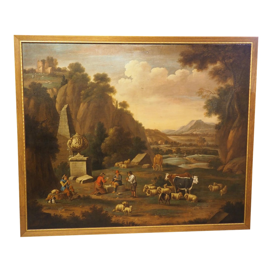 Large 18th Century Dutch Oil on Canvas Painting of a Southern Landscape, Ex Portland Art Museum: Measuring 56 H x 67 W, this large Dutch oil on canvas painting from the 1700s depicts a Southern landscape of a glen beneath a rocky cliff. The expansive valley stretches far into the distance,