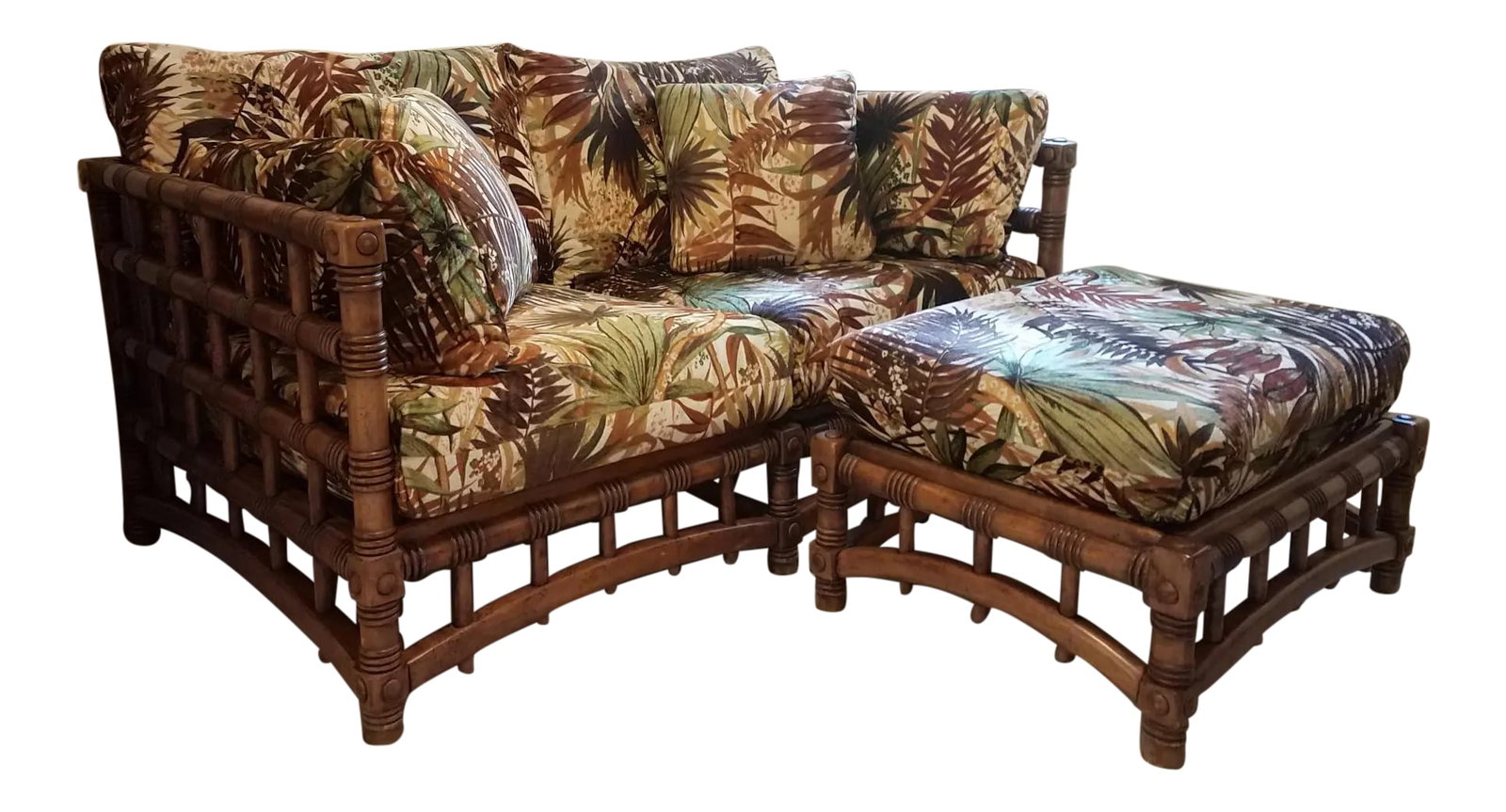 1980s Vintage Tropical Inspired Loveseat and Matching Ottoman: Solid wood frame carved to resemble bamboo. Colorful tropical pattern of earth tones on a cream background. Soft velveteen fabric with zippers on each cushion and pillow. Very nicely made. Love seat