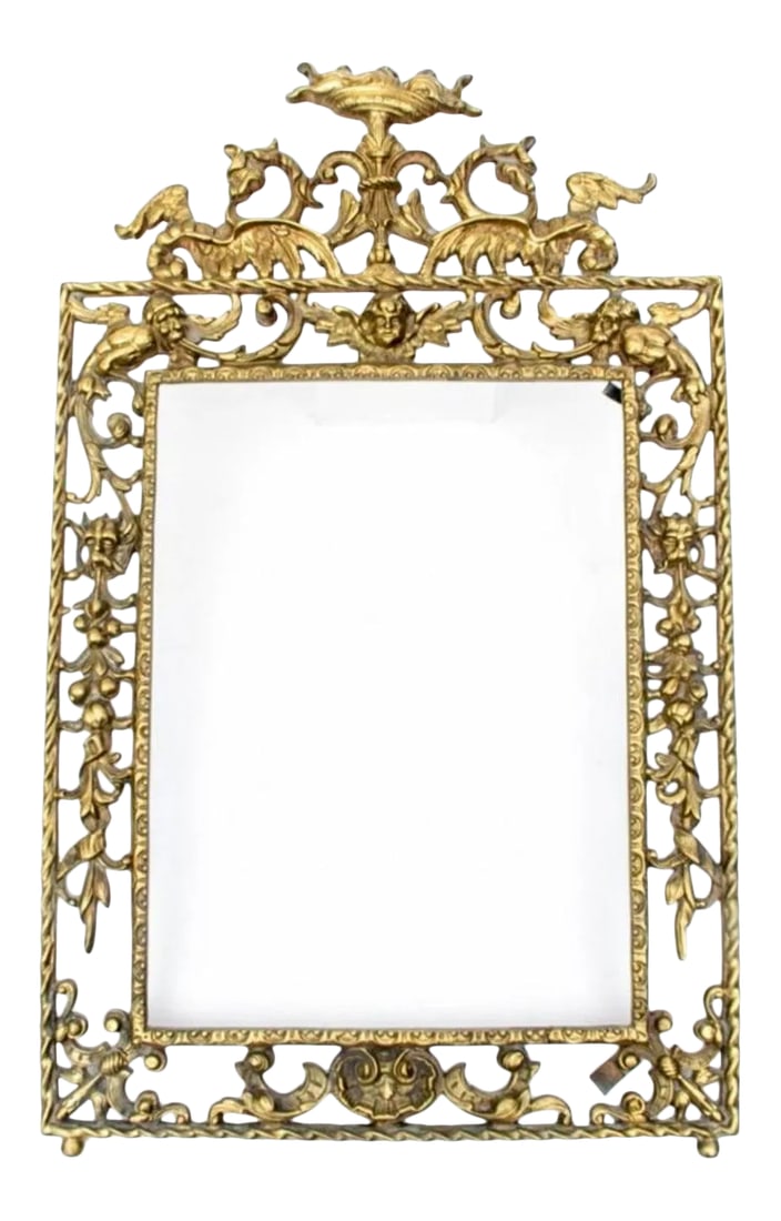 19th Century Spanish Gilt Bronze Picture Frame: A stunning Spanish gilt bronze picture frame, embellished in Gothic Victorian era styling, with ornate pierced motif having fruit, shell, scroll, putti and grotesque mask motifs around the perimeter,
