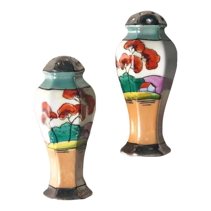 Late 20th Century Hand-Painted Japanese Lusterware Salt and Pepper- A Pair: Pair of hand painted salt and pepper shakers depicting a landscape in a lovely iridescent finish. Made in Japan. 4" tall. Condition: Alterations: Original Condition Unaltered Imperfections: Some