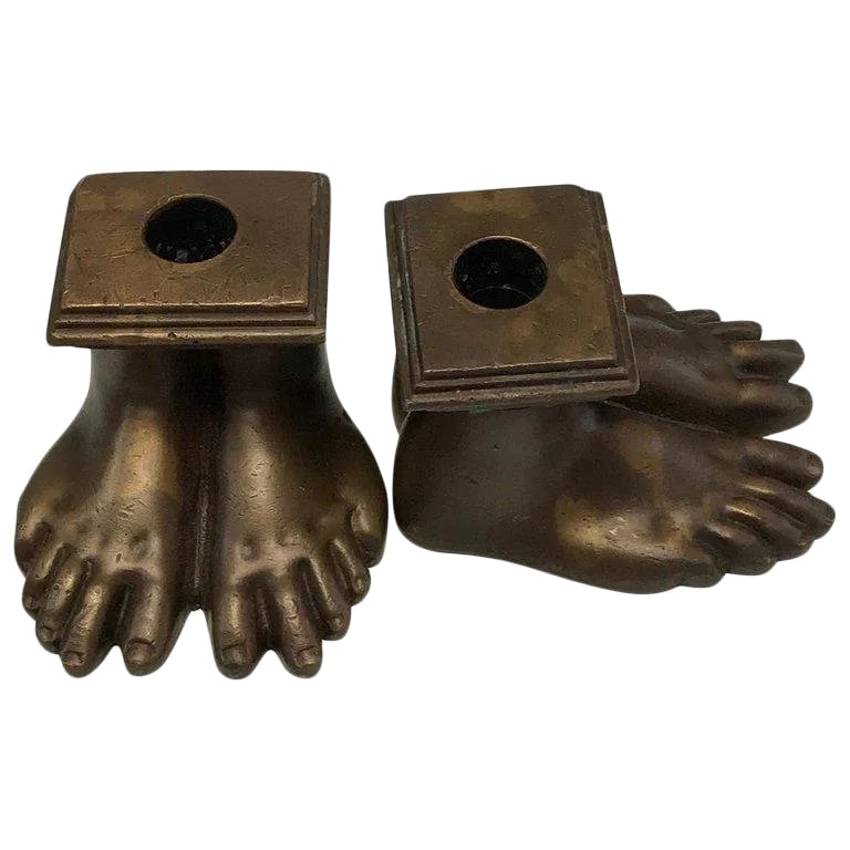 19th Century Grand Tour Roman Feet Bronze Candlesticks - a Pair: Pair of 19th century grand tour Roman feet bronze candlesticks, each one realistically cast of one pair of human feet, that hold one standard candle. Condition: Alterations: Unknown Imperfections: