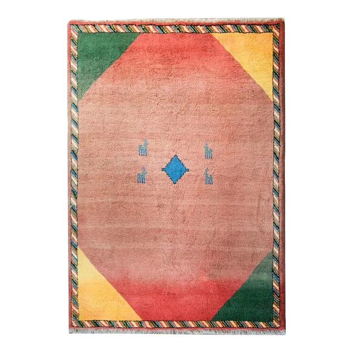 Vintage Persian Gabbeh Rug: A gorgeous and playful vintage Persian Gabbeh rug with a crimson abrash ombre field with a bright indigo diamond medallion flanked by pairs of indigo goats, and a wonderful border with brilliant
