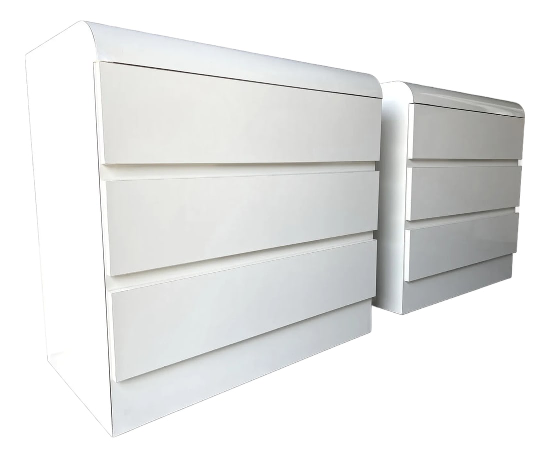 Pair of Vintage 1980s Postmodern Waterfall Dressers in Ivory Laminate - Restored 3-Drawer Cabinets: Elevate your space with this striking pair of vintage 1980s waterfall dressers, a quintessential example of postmodern design. Finished in a smooth ivory-colored laminate, each piece showcases the ico