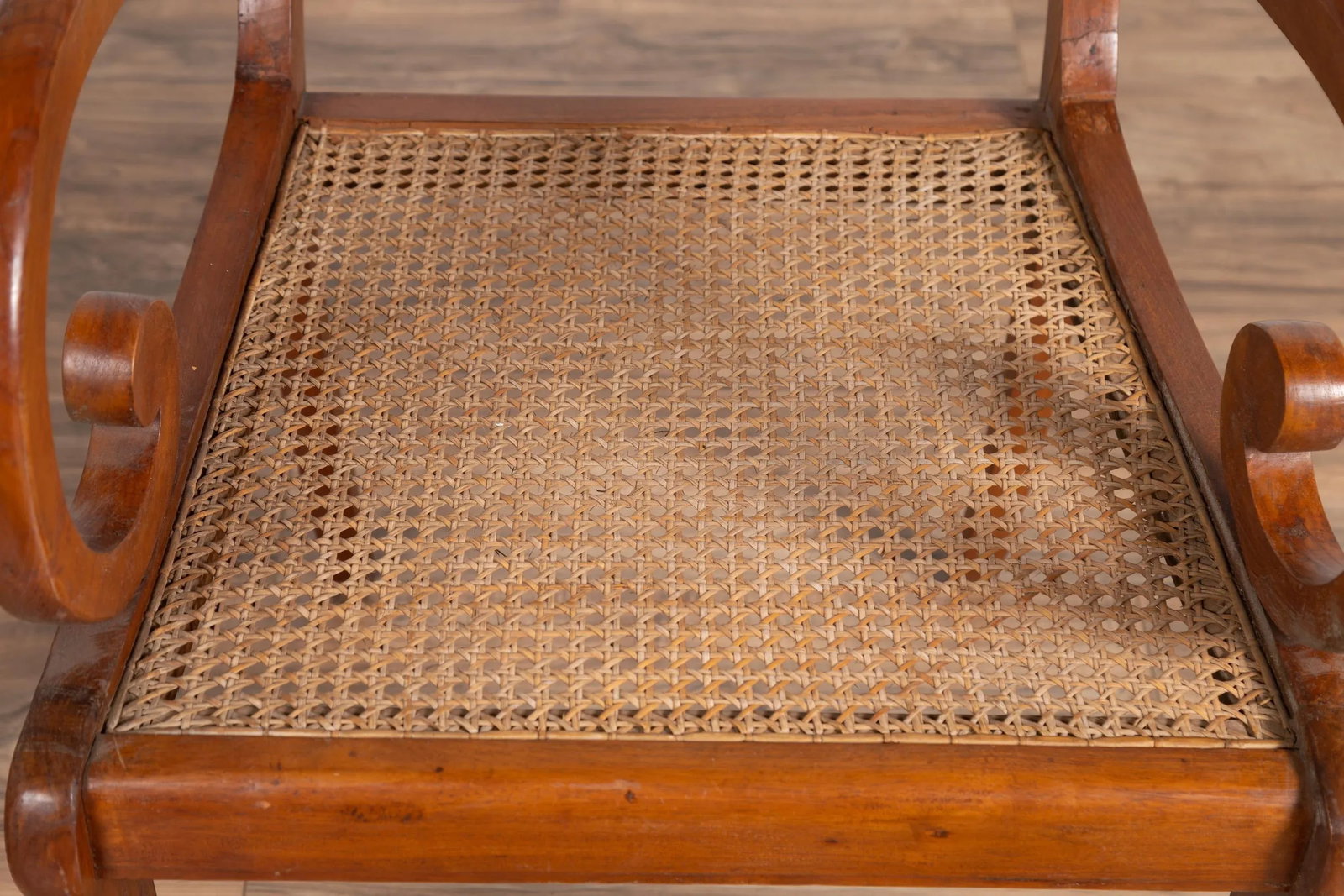 Antique Javanese Wooden Armchair with Carved Back, Curving Arms and Rattan Seat - 12