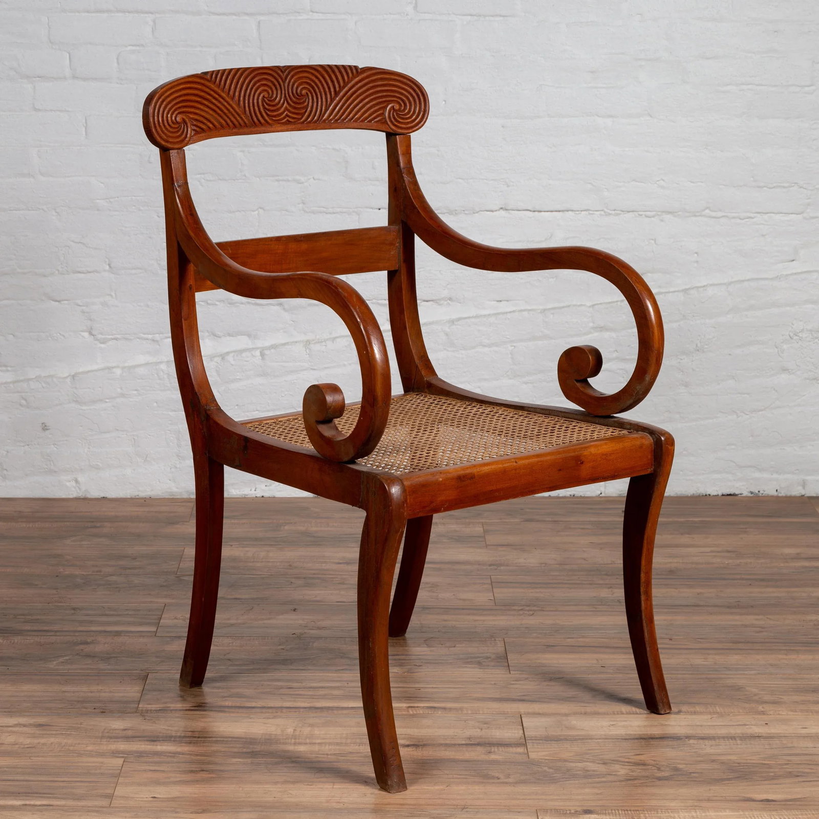 Antique Javanese Wooden Armchair with Carved Back, Curving Arms and Rattan Seat - 2