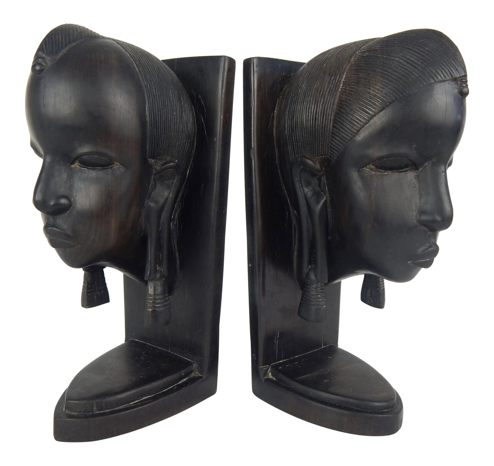 African Ebony Wood Bust Bookends - a Pair: Vintage hand-crafted Ebony Wood bookends featuring traditionally-coiffed tribal busts with delicate features. Each bookend is similar, yet distinct. Condition: Alterations: Original Condition