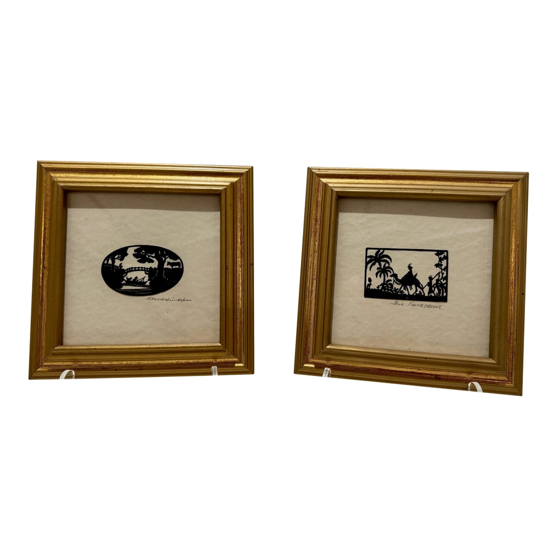 Pair of Early 20th-Century German Silhouette Cut-Paper Artworks - "Abendsplinden" & "Die Karawane",: Charming pair of finely executed German silhouette (Scherenschnitt) artworks, likely dating from the early 20th century. Each is meticulously cut by hand in black paper and mounted on cream stock,