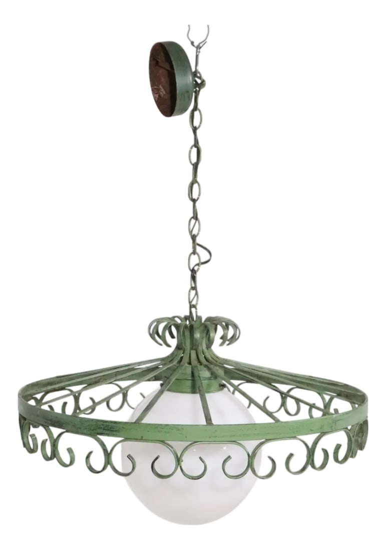1970s Brutalist Spanish Style Wrought Iron Chandelier After Umanoff: Stylish vintage wrought iron and glass hanging fixture having a wrought iron frame which surrounds the glass ball center globe. The metal structure is in original green paint finish, and includes the 