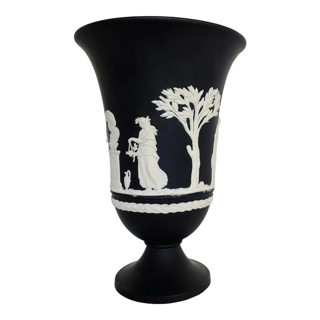 20th Century Black Wedgwood Jasperware Urn Shape Vase: Wedgwood's classic black jasperware, a timeless piece of unglazed stoneware. Features detailed application of "Bas Relief" design of ancient Roman/Greece motif. Prefect Ebony distinction. Condition: A
