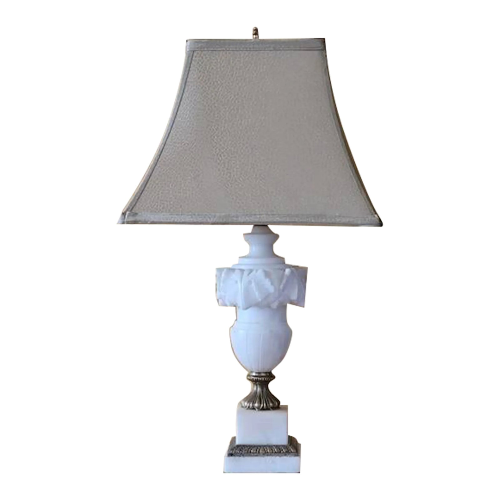 Vintage Carved Alabaster and Brass Table Lamp: French carved Alabaster and Brass table lamp in very good vintage condition. The lamp comes with a harp and brass finial. The design is neoclassical. Dimensions: 21"H x 5"W x 5"W Weight: 7LBS 1.1OZS C