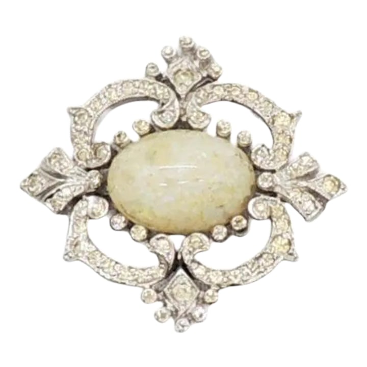 Vintage Signed Panetta Rhodium Plated Faux-Opal Brooch: This is part of Chairish's Costume Jewelry assortment. Circa 1960s rhodium plated cabochon faux-opal with small round clear rhinestone accents brooch with security clasp. Marked "Panetta." Measures: