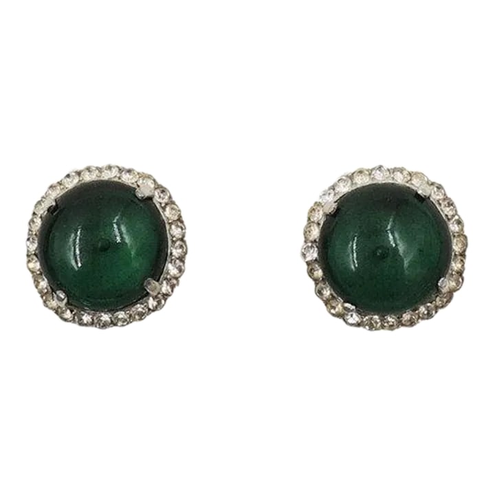 Vintage Castlecliff Faux-Emerald & Clear Rhinestone Clip Earrings - 2 Pieces: This is part of Chairish's Costume Jewelry assortment. Circa early 1950s round rhodium plated cabochon faux-emerald and clear round paste accents clip earrings. Marked "Castlecliff." Measure: 7/8 inch