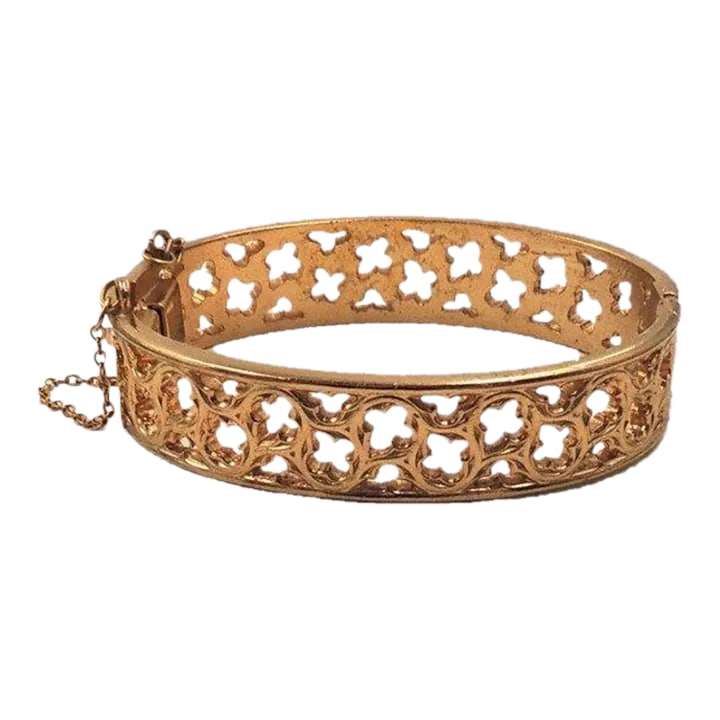 Vintage 1972 Signed Napier Gothic Style Goldtone Cuff Bracelet: This is part of Chairish's Costume Jewelry assortment. Gothic style goldtone cut out thin cuff bracelet with box clasp and security chain. Marked "Napier." Measures: 9/16 inches tall by 2 3/4 inches w