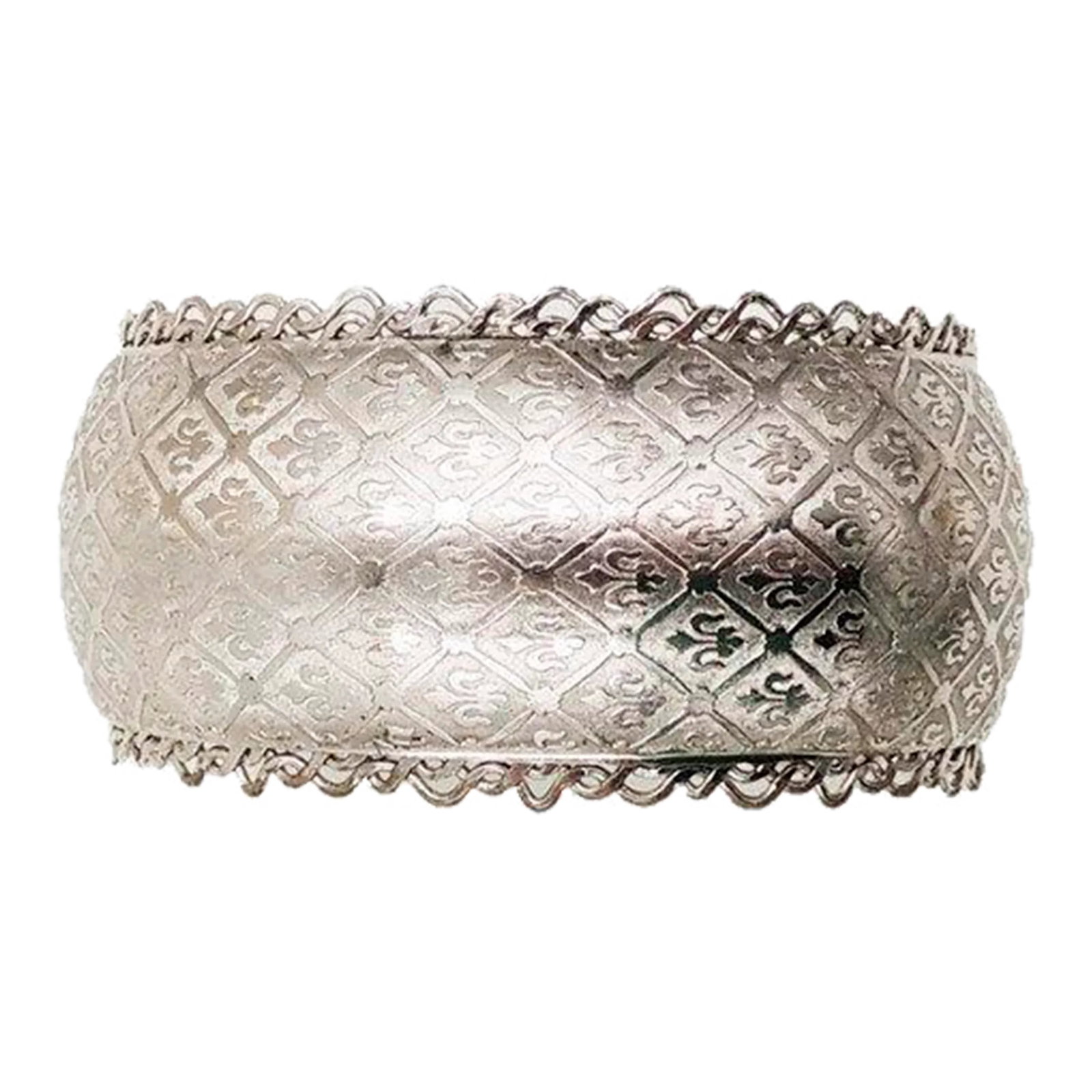 1960s Jewels by Julio Silvertone Fleur de Lis Cuff Bracelet: This is part of Chairish's Costume Jewelry assortment. 1960s rhodium plated fleur de lis cuff bracelet. Marked "Jewels by Julio." Measures: 2 1/4 inches wide by 1 3/16 inches tall by 2 inches deep.