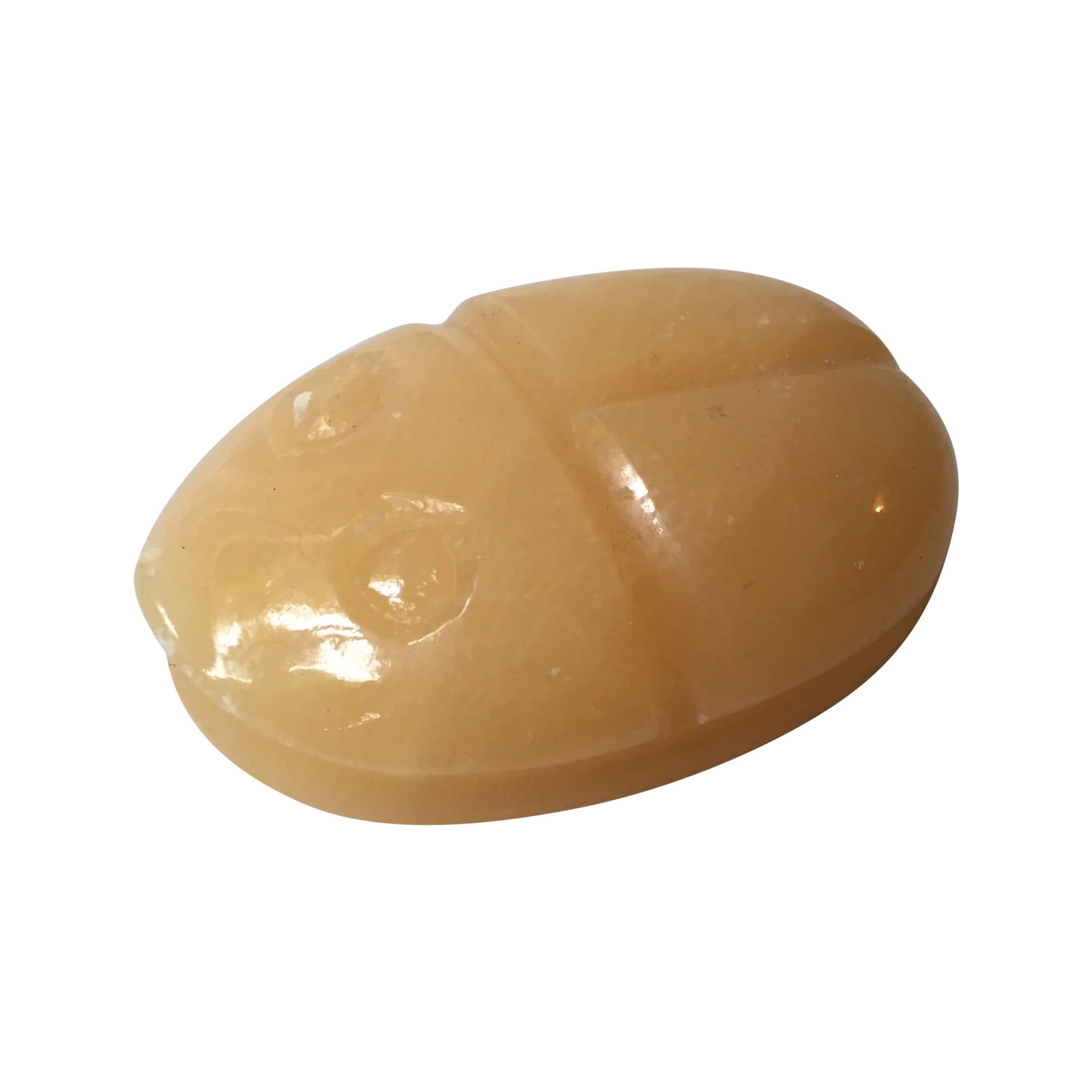 Stone Scarab Paperweight: This opaque stone scarab paperweight has a fantastic tangerine color and would be a unique desk accessory. This decorative accent has a few spots of wear to the carved edges, but overall it's in good