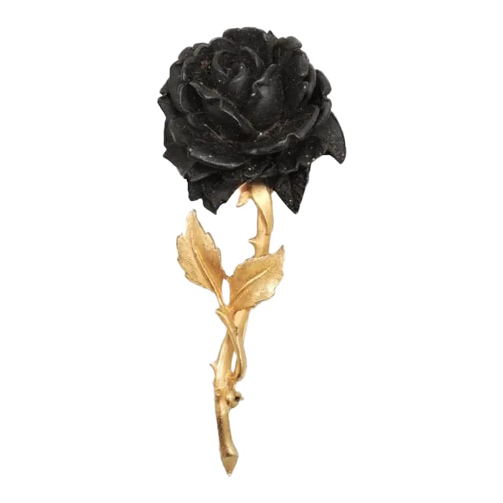Vintage Accessocraft Black Rose Brooch: This is part of Chairish's Costume Jewelry assortment. Circa 1960 goldtone black carved wood (probably Ebony) rose brooch with security clasp. Marked "Accessocraft N.Y.C." Measures: 3 1/2 inches long 