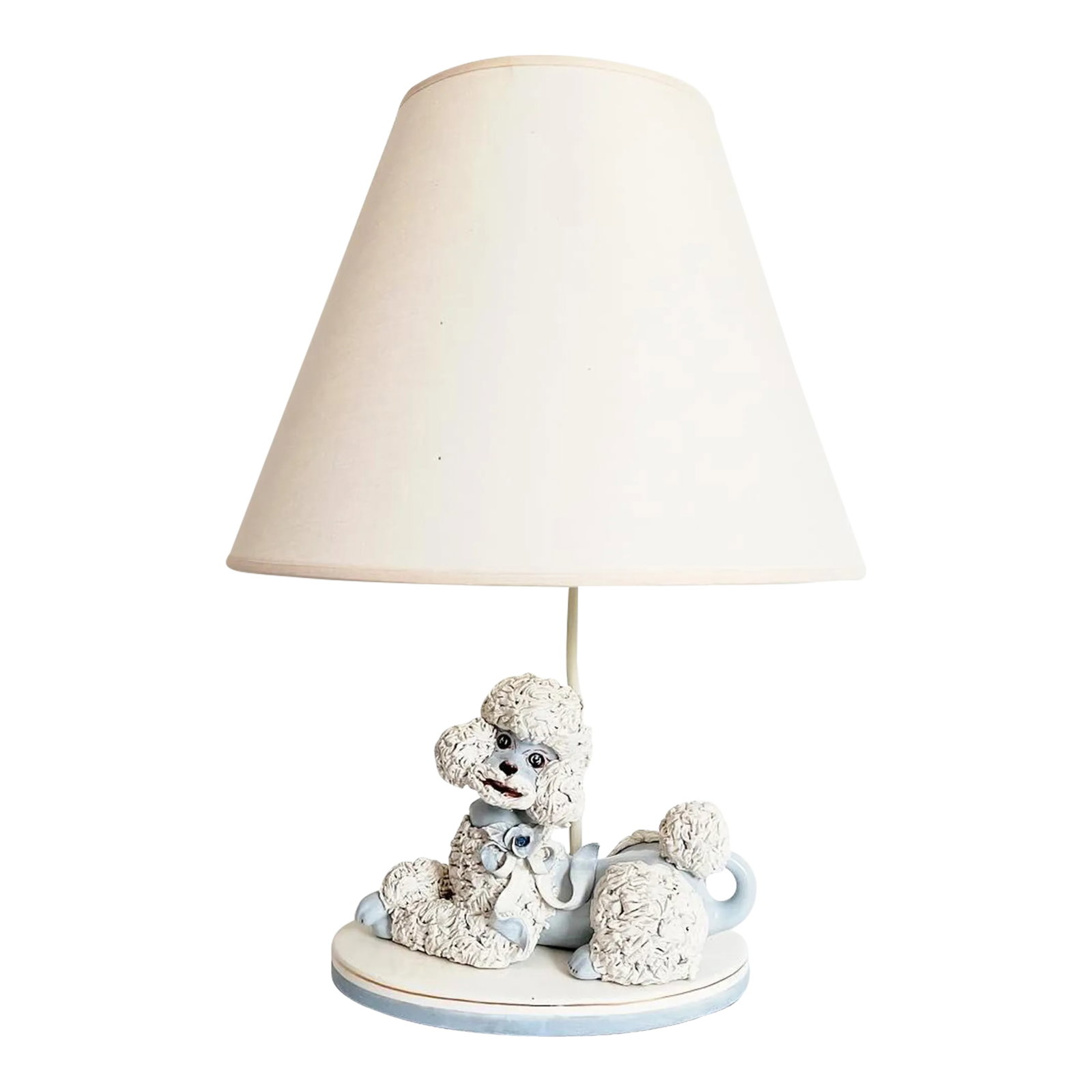 1950s French Poodle Lamp & Shade: Charming 1950s glazed and hand painted creamy white and French blue ceramic poodle lamp with applied "spaghetti" style lion cut head, legs, and tail complete with painted nails and a dimensional rose 