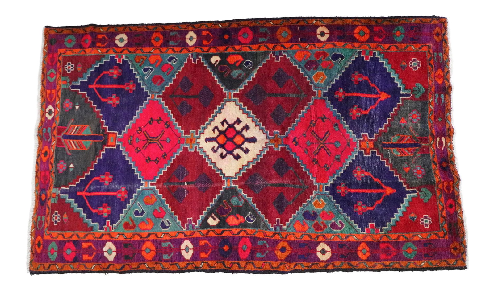 1940s Persian Rug - 4'9'' * 7'10'': This colorful gypsy rug has the best colorway if you're looking for lush exotic bold tones like purple, turquoise, pink and mandarin. The vibrant pattern will create an amazing focal point in your spa