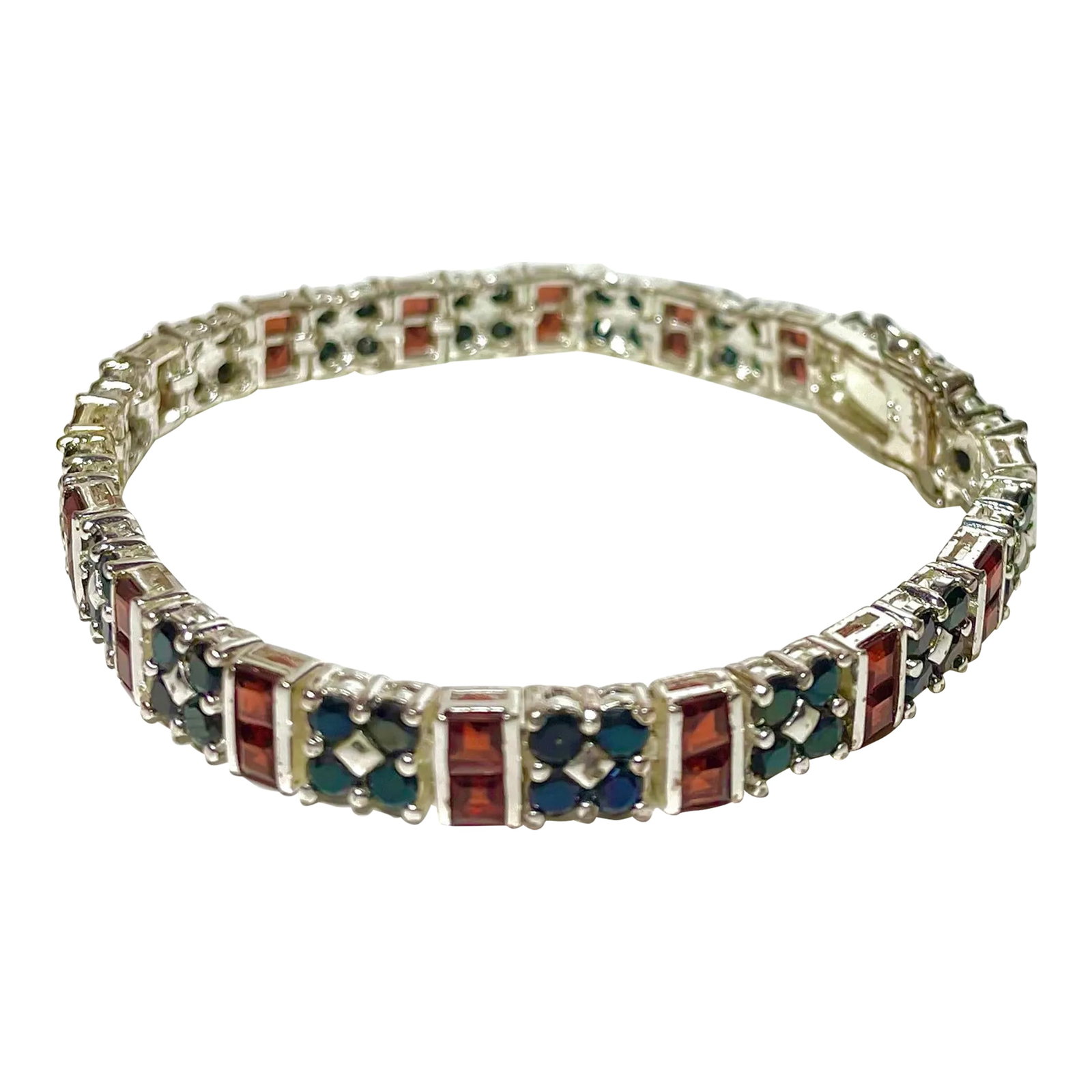Sterling Silver Rhodium, Ruby, and Sapphire Double Row Tennis Bracelet: This is part of Chairish's Fine Jewelry assortment. Gorgeous bracelet of Sterling Silver Plates in platinum (rhodium) with a double row of alternating rubies and sapphires. This is in a tennis