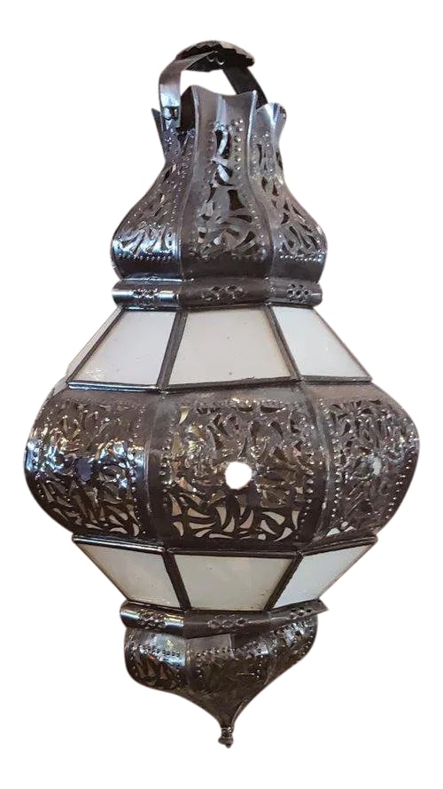 Moroccan Metal and White Frosted Glass Bok Style Lantern: Handmade Moroccan glass lantern with frosty white stain glass and metal rustic frame, measuring around 20" in height and 10" in width. Very elegant, with lots of piercing in both top and bottom