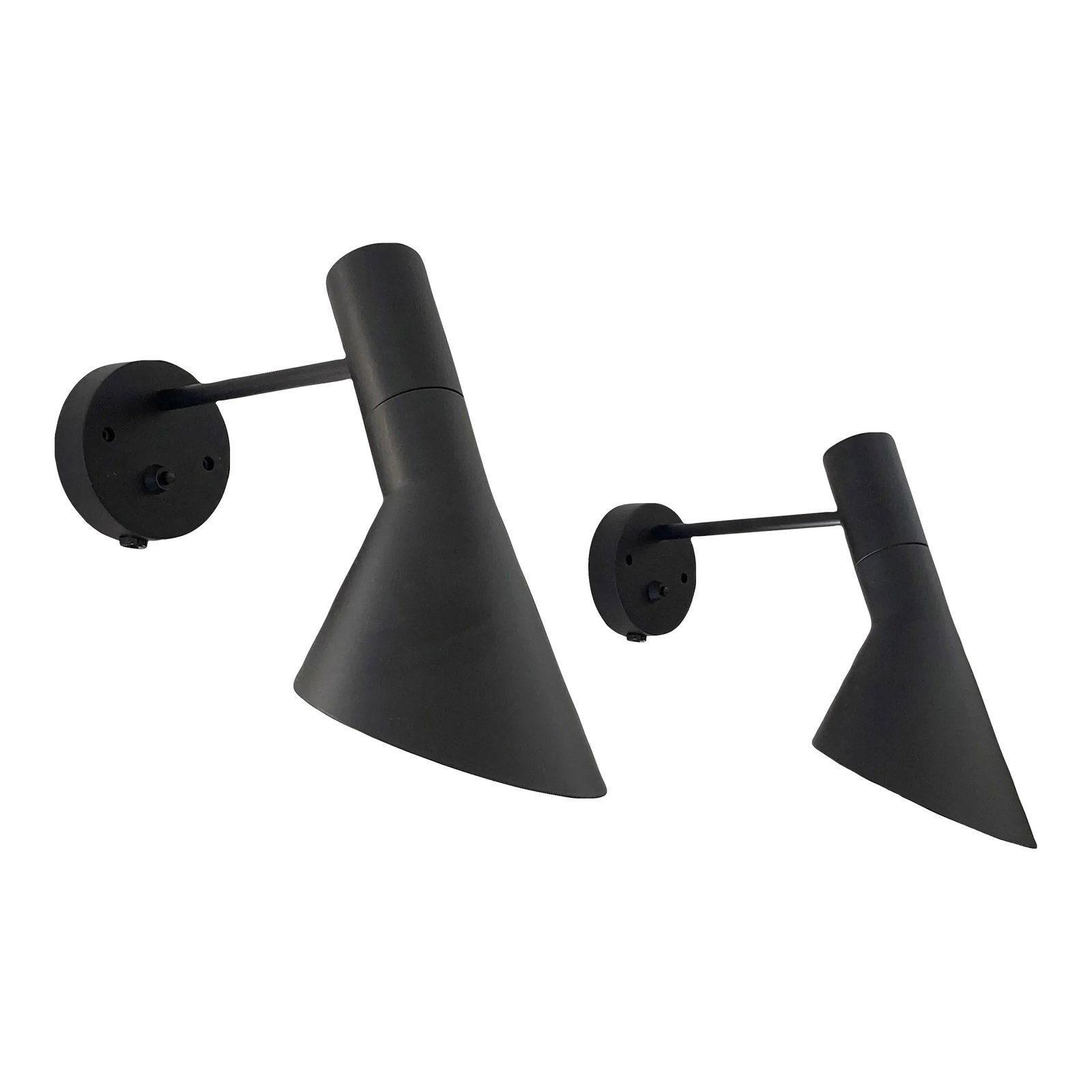 Danish Modern Arne Jacobsen Black Aj Wall Sconces: Arne Jacobsen AJ wall sconces for Louis Poulsen. These are made to plug into your wall's outlets but can probably be hardwired into the wall as well by removing the cords. The angle of the shade can
