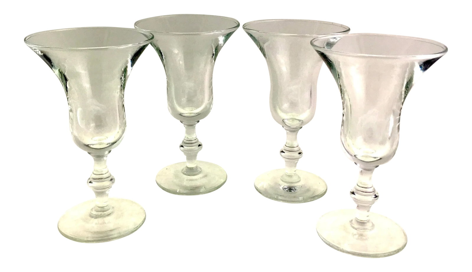 Early 19th Century Flint Crystal Glassware - Set of 4: Set of 4 flint glass, 19th-century glasses with baluster stems and shaped flared rims. They are highly refractive and beautifully executed. Dimensions: 3.25" x 3.25" x 5.5" 19th Century Collection