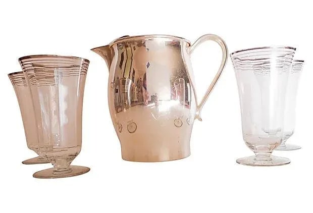 Silver Plate Pitcher and Glasses - Set of 5: Mid Century Five-piece serving set, including a silver over copper water pitcher ( 8.75"L x 5"W x 7.5"H), and four water glasses (5.5"H x 3.25"Dia). Excellent. Condition: Alterations: Original