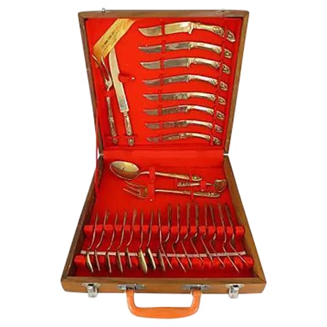 Midcentury Asian Flatware Set with Box: Midcentury Thai brass flatware set of 29 pieces and one teak wood case consisting of: eight 6" teaspoons; eight 6.6" dessert forks; eight 8" dinner knives; one 9" serving spoon; one 8" serving fork;