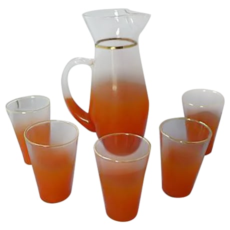 Orange Lemonade Pitcher & Glasses - Set of 6: 6-Pieces of lemonade service. Dimensions: pitcher, 6"Dia x 9"H; five glasses, 2.75"Dia x 4"H. No maker's mar. Circa 1960s. Condition: Alterations: Original Condition Unaltered Imperfections: Some